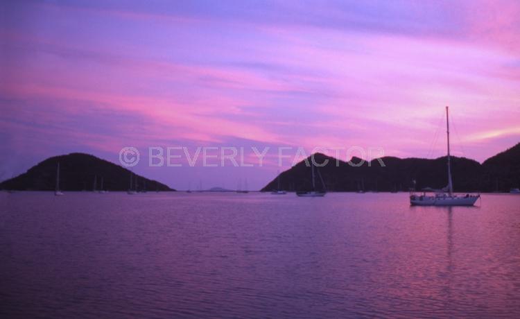 Island;Sunset;sky;sun;water;red;sillouettes;ocean;boats;purple;sea of cortez